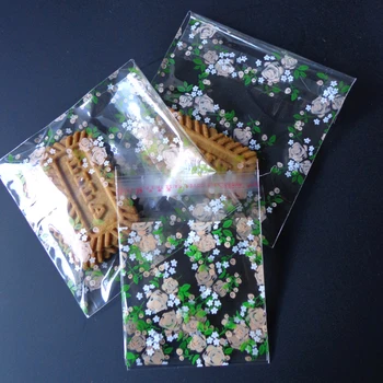 100pcs Blomst Cookie Slik Poser Selvklæbende Klar Floral Party Gave Poser 10x10cm Papirvarer Plastik Kuvert
